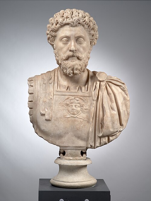 Marble bust of Marcus Aurelius against a light background